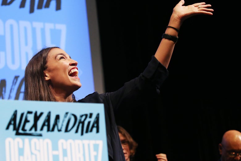 Alexandria Ocasio-Cortez waves to supporters at a fundraiser in Los Angeles.